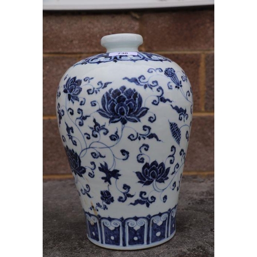 636 - A Chinese blue & white Meiping vase decorated with scrolling flowers, 30cms high.