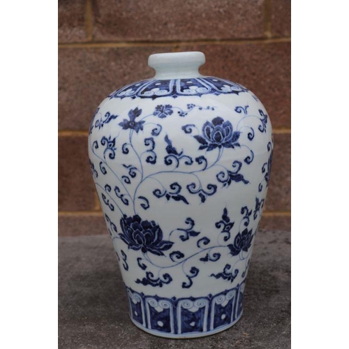 636 - A Chinese blue & white Meiping vase decorated with scrolling flowers, 30cms high.