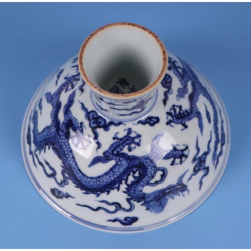 640 - A Chinese blue & white stem bowl decorated with dragons amongst clouds, four character blue mark... 