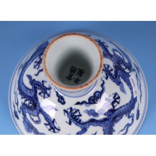 640 - A Chinese blue & white stem bowl decorated with dragons amongst clouds, four character blue mark... 