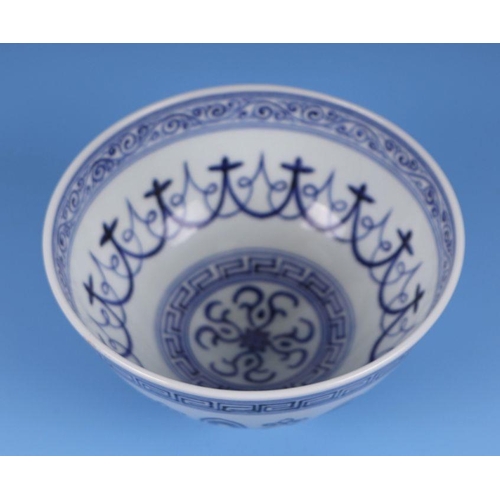 641 - A Chinese blue & white footed bowl, 9cms high.