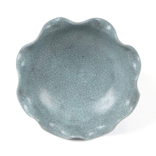 650 - A Chinese celadon crackle glaze pedestal bowl, 16cms diameter.