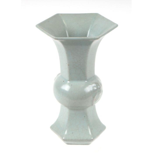 651 - A Chinese Gu form celadon glaze vase, 17cms high.