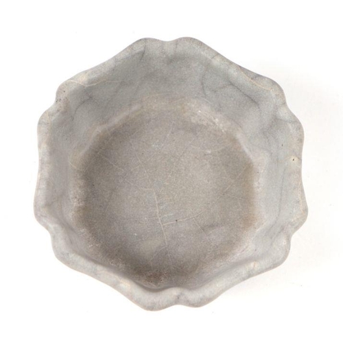 654 - A Chinese pale celadon crackle ware brush washer, 9cms diameter.