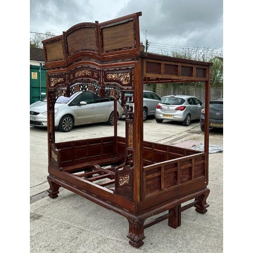 659 - An impressive Chinese elm wood marriage bed.