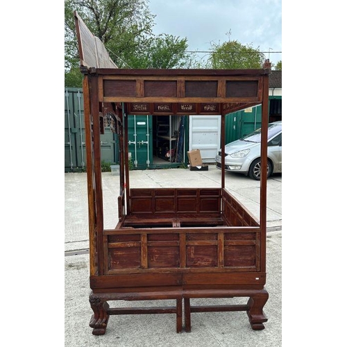 659 - An impressive Chinese elm wood marriage bed.