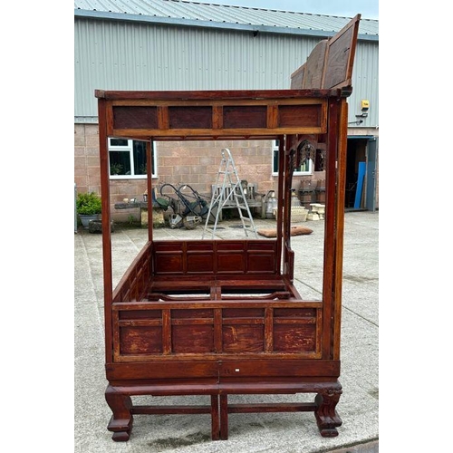 659 - An impressive Chinese elm wood marriage bed.