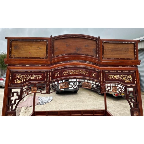 659 - An impressive Chinese elm wood marriage bed.