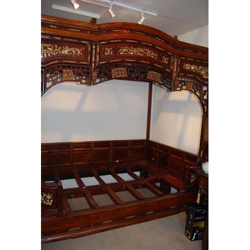 659 - An impressive Chinese elm wood marriage bed.