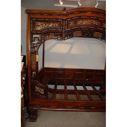 659 - An impressive Chinese elm wood marriage bed.