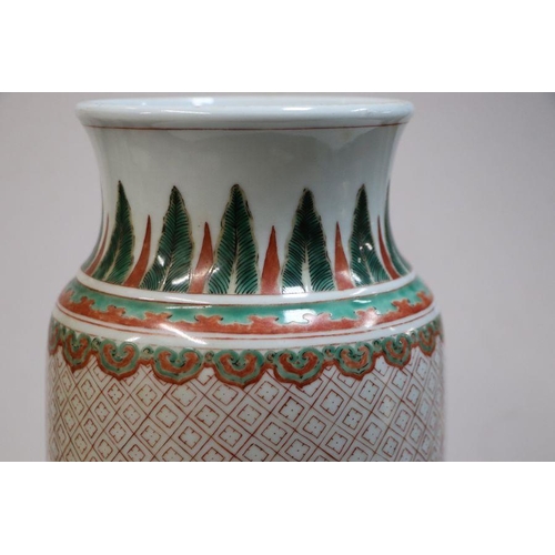 670 - A Chinese famille vert vase of cylindrical tapering form decorated with figures in a landscape withi... 