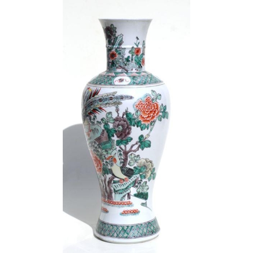 672 - A large Chinese famille vert vase decorated with birds amongst flowering foliage, 45cms high.Conditi... 