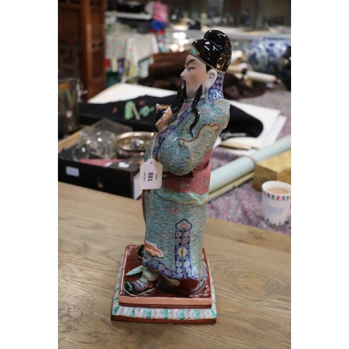 673 - A Chinese figure of Guan Gong with impressed seal mark to the underside, 44cms high.Condition Report... 