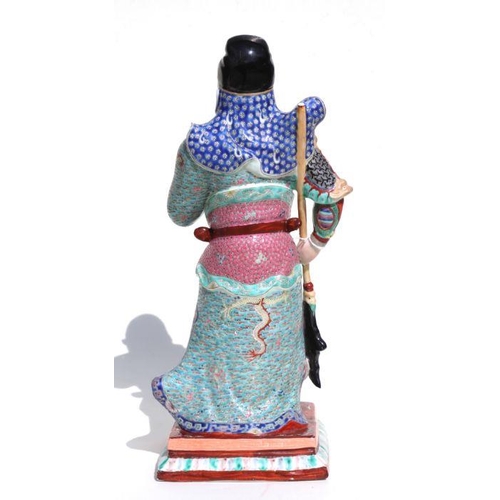 673 - A Chinese figure of Guan Gong with impressed seal mark to the underside, 44cms high.Condition Report... 