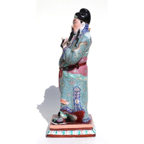 673 - A Chinese figure of Guan Gong with impressed seal mark to the underside, 44cms high.Condition Report... 