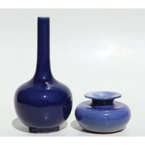 684 - A Chinese blue monochrome bottle vase, 22cms high; together with a blue glazed vase of compressed ci... 