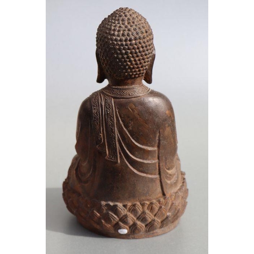 685 - A Chinese cast figure depicting a seated Buddha on a lotus flower pedestal, 33cms high.Condition Rep... 