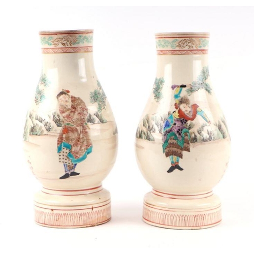 695 - A pair of Japanese Satsuma vases decorated with figures on horseback with, seven character red mark,... 