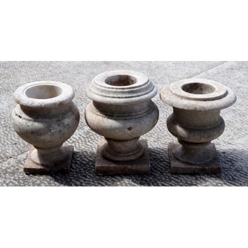 7 - Three turned marble urns, the largest 16cms high (3).