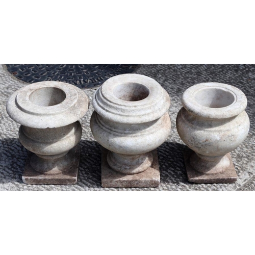 7 - Three turned marble urns, the largest 16cms high (3).