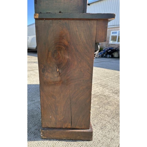 703 - A Victorian bookcase on cupboard, the pair of glazed doors enclosing a shelved interior with cupboar... 