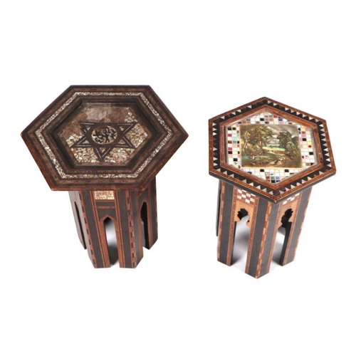 706 - Two inlaid Moroccan occasional tables of hexagonal form, the largest 37cms wide (2).