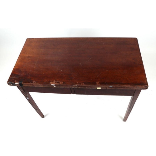 731 - A late Victorian mahogany tea table, the rectangular fold-over top above a central frieze drawer, on... 