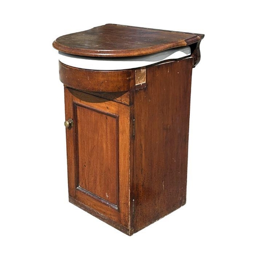 738 - A late 19th century mahogany vanity unit with lift-up top enclosing a ceramic sink and cupboard bene... 