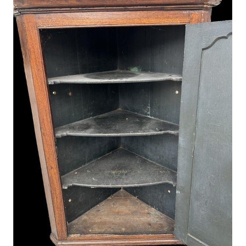 739 - A 19th century oak corner cupboard with shelved interior, 78cms wide.