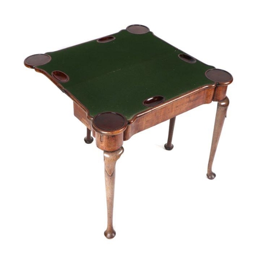 749 - A George III mahogany card table on turned legs terminating in pad feet, 84cms wide.