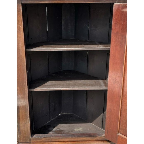 750 - A 19th century oak wall hanging corner cupboard.