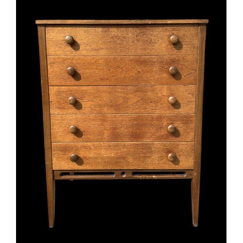 753 - A mid 20th century teak chest in the manner of Heal's with an arrangement of five long drawers, on t... 