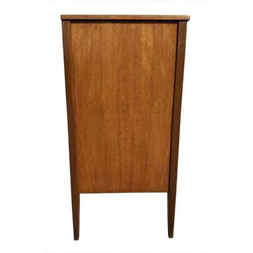 753 - A mid 20th century teak chest in the manner of Heal's with an arrangement of five long drawers, on t... 