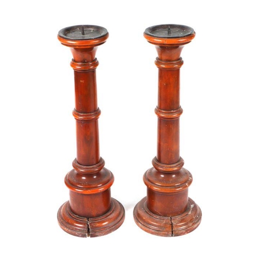 775 - A pair of 19th century fruitwood floor standing pricket or candlesticks with tapering ring turned co... 