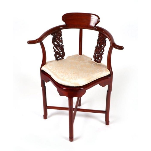 788 - A Chinese hardwood corner chair with silk upholstered cushion.