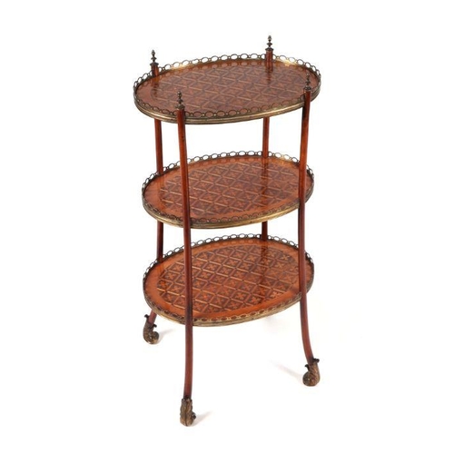 789 - A French inlaid three-tier oval etagere with ormolu mounts, 42cms wide.