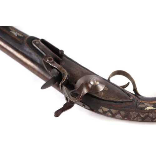 81 - An Afghan flintlock pistol with Brown Bess steel flintlock action, 42cms long.