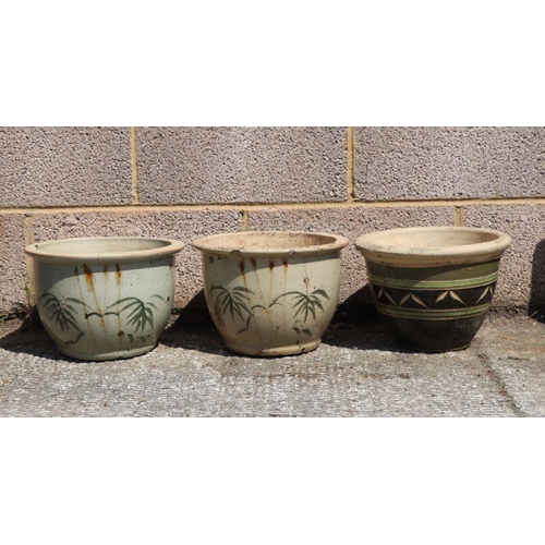 9 - A pair of glazed pottery circular planters decorated with bamboo, 30cms diameter; together with anot... 