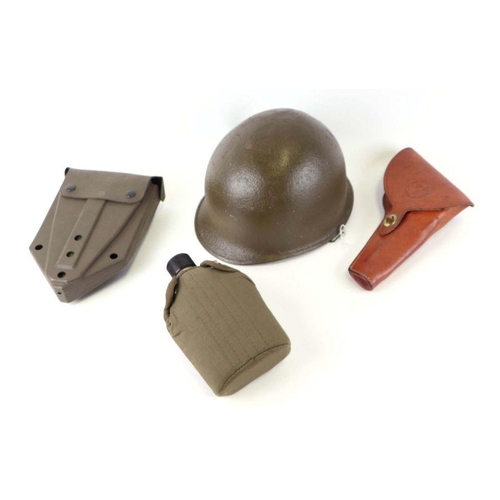 94 - A quantity of assorted militaria to include a USA steel helmet; a collapsible field shovel; goggles;... 