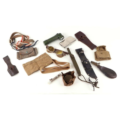 94 - A quantity of assorted militaria to include a USA steel helmet; a collapsible field shovel; goggles;... 