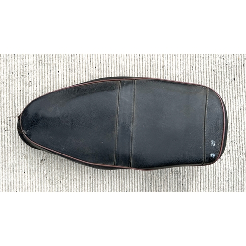 32 - A BSA ZB Gold Star saddle; together with a pair of black leather motorcycle boots.