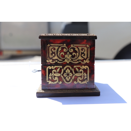 403 - A 19th century French Boulle work scent bottle box containing eight green glass scent bottles with g... 