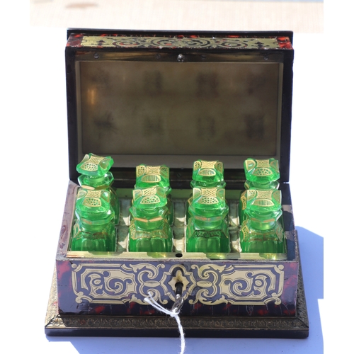 403 - A 19th century French Boulle work scent bottle box containing eight green glass scent bottles with g... 