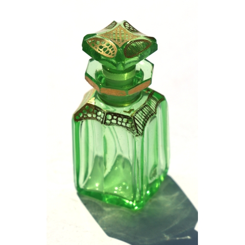 403 - A 19th century French Boulle work scent bottle box containing eight green glass scent bottles with g... 