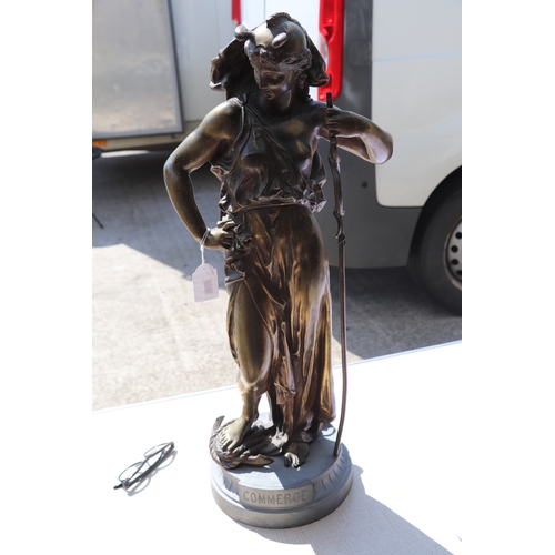 396 - A French bronzed spelter figure 'Commerce', stamped 'H Dumaige', 71cms high.