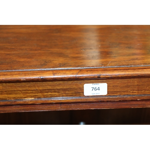 764 - An early 20th century oak open bookcase with an arrangement of adjustable shelves, on bracket feet, ... 