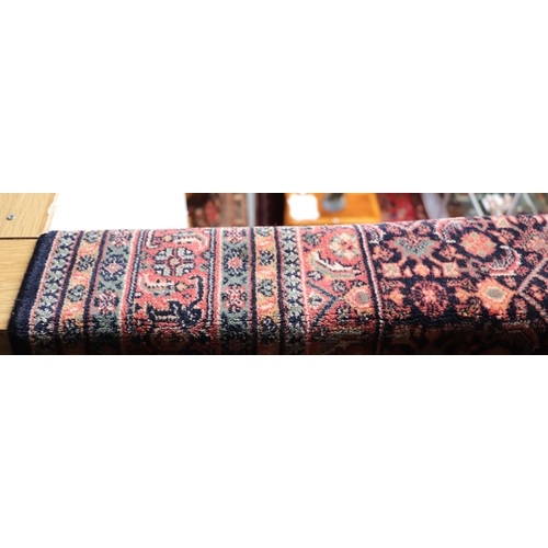 133 - A Persian Kashan rug with geometric design on a pink ground, 170 by 237cms.