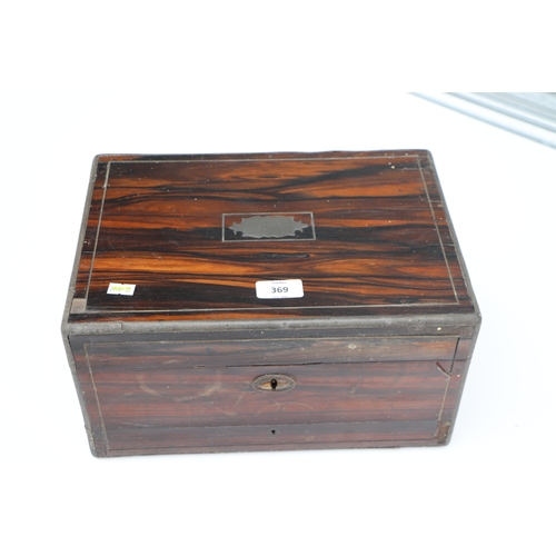 369 - A George III coromandel dressing box retailed by T Briggs, the fitted interior with an assortment of... 