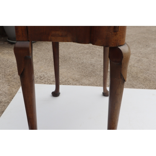 749 - A George III mahogany card table on turned legs terminating in pad feet, 84cms wide.