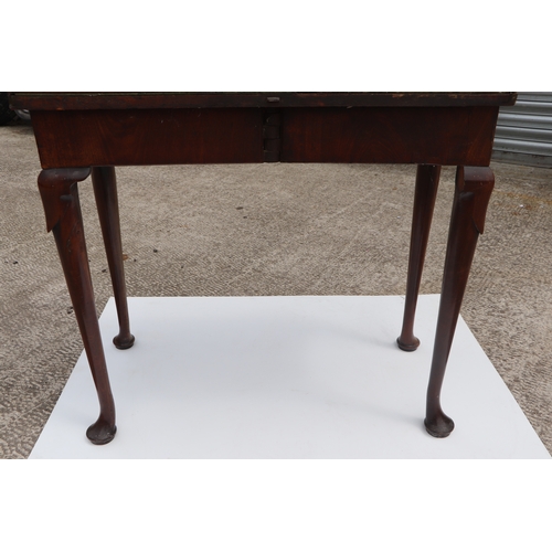 749 - A George III mahogany card table on turned legs terminating in pad feet, 84cms wide.